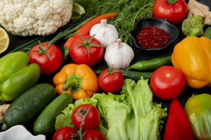 side view of vegetables as tomato garlic pepper cucumber and others with spices